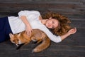 A young beautiful girl holding a wild fox animal that was traumatized by a man and rescued by her and now lives as before