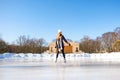 Young beautiful girl ice skating