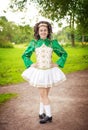 Young beautiful girl in irish dance dress posing outdoor