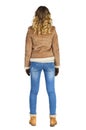 Young beautiful girl in a leather sheepskin coat and blue jeans Royalty Free Stock Photo