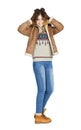 Young beautiful girl in a leather sheepskin coat and blue jeans Royalty Free Stock Photo