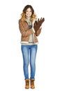 Young beautiful girl in a leather sheepskin coat and blue jeans Royalty Free Stock Photo