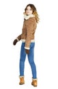 Young beautiful girl in a leather sheepskin coat and blue jeans Royalty Free Stock Photo