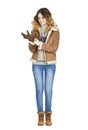 Young beautiful girl in a leather sheepskin coat and blue jeans Royalty Free Stock Photo