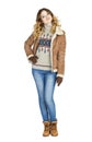 Young beautiful girl in a leather sheepskin coat and blue jeans Royalty Free Stock Photo