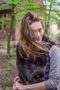 A young beautiful girl with long hair walks through the spring Stryjsky park in Lviv Royalty Free Stock Photo