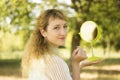 Young beautiful girl look into mirror in the park.Soft and blur conception. Royalty Free Stock Photo