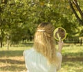 Young beautiful girl look into mirror in the park.Soft and blur conception. Royalty Free Stock Photo