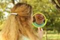 Young beautiful girl look into mirror in the park.Soft and blur conception Royalty Free Stock Photo