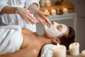 Young beautiful girl in mask for face relaxing in spa salon. Royalty Free Stock Photo