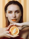 Beautiful girl with an orange
