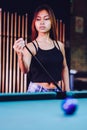 Young beautiful girl playing billiard in a club Royalty Free Stock Photo