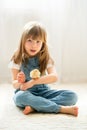 Young beautiful girl, playing with little newborn chick at home Royalty Free Stock Photo