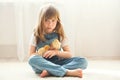 Young beautiful girl, playing with little newborn chick at home Royalty Free Stock Photo