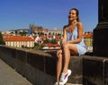 Young beautiful girl posing on the Charles Bridge