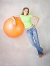 Young beautiful girl relies on a balloon Royalty Free Stock Photo