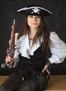 Young beautiful girl - sea pirate with pistol Royalty Free Stock Photo