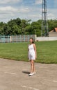 Young beautiful girl in short white dress with windswept hair Royalty Free Stock Photo