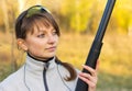 Young beautiful girl with a shotgun Royalty Free Stock Photo