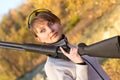 Young beautiful girl with a shotgun Royalty Free Stock Photo