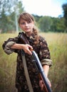 Young beautiful girl with a shotgun Royalty Free Stock Photo