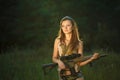 Young beautiful girl with a shotgun in an outdoor Royalty Free Stock Photo