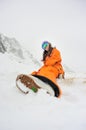 Young beautiful girl snowboarder in motion Royalty Free Stock Photo