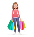 A young beautiful girl stands with multi-colored paper bags from shopping. Happy woman in glasses with packages goes shopping Royalty Free Stock Photo