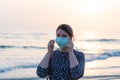 Young beautiful girl stands near the sea Royalty Free Stock Photo