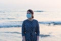 Young beautiful girl stands near the sea Royalty Free Stock Photo