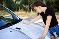 Young beautiful girl studying the map Royalty Free Stock Photo