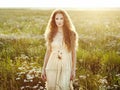 Young beautiful girl on a summer field. Beauty summertime Royalty Free Stock Photo