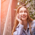 Young beautiful girl using phone. Smiling female person Royalty Free Stock Photo