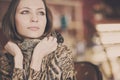 A young beautiful girl waiting for a cup of tea in a cafe Royalty Free Stock Photo