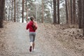 Young beautiful girl warming up before a jog in the Park Royalty Free Stock Photo