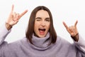 Young beautiful girl wearing casual purple sweater standing over isolated white background shouting with crazy Royalty Free Stock Photo