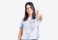 Young beautiful girl wearing casual t shirt looking unhappy and angry showing rejection and negative with thumbs down gesture Royalty Free Stock Photo