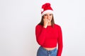 Young beautiful girl wearing Christmas Santa hat standing over isolated white background looking stressed and nervous with hands Royalty Free Stock Photo
