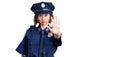 Young beautiful girl wearing police uniform doing stop sing with palm of the hand Royalty Free Stock Photo