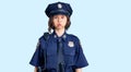 Young beautiful girl wearing police uniform puffing cheeks with funny face Royalty Free Stock Photo