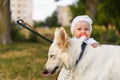 Young beautiful girl with a white Swiss shepherd Royalty Free Stock Photo