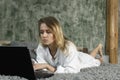 Young beautiful girl working on computer at home Royalty Free Stock Photo