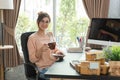 Young beautiful girl working at home, young entrepreneur concept Royalty Free Stock Photo