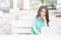 Young and beautiful girl Working On Laptop In Cafe Royalty Free Stock Photo