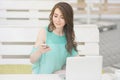 Young and beautiful girl Working On Laptop In Cafe Royalty Free Stock Photo