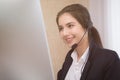 Young beautiful girl working at a laptop in a small medium enterprise Royalty Free Stock Photo