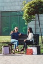 Beautiful girls with paper bags outside shopping mall Royalty Free Stock Photo