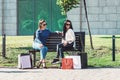 Beautiful girls with paper bags outside shopping mall Royalty Free Stock Photo