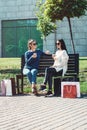 Beautiful girls with paper bags outside shopping mall Royalty Free Stock Photo