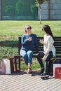 Beautiful girls with paper bags outside shopping mall Royalty Free Stock Photo